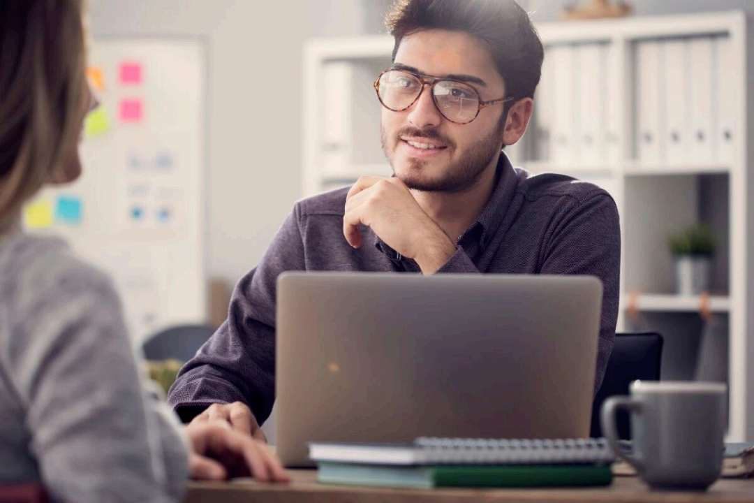 Student reviewing recorded interview feedback with a tutor
